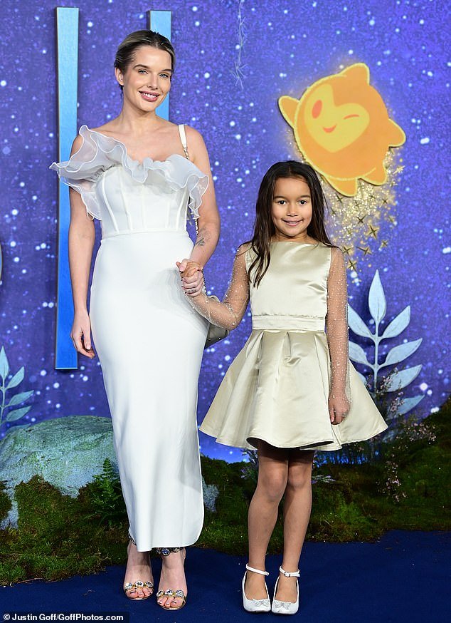 Mother and daughter: Helen Flanagan looked typically chic in a silk white dress as she walked the red carpet with daughter Matilda