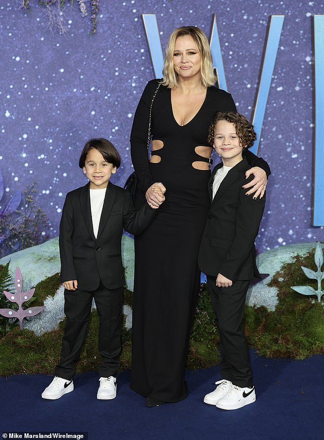 Big smiles: Kimberley held her little ones close as the family trio beamed for the camera, while Bobby and Cole donned a matching suit and rocked white Nike AirForce