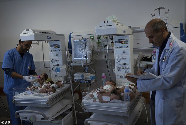 Doctors prepare premature babies for transport to Egypt after they were evacuated from Shifa Hospital in Gaza City to a hospital in Rafah
