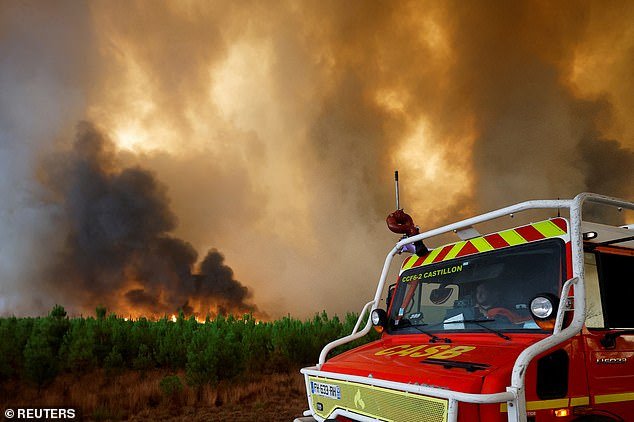 Firefighters work to contain a blaze in Bellin-Belette, as wildfires spread through the Gironde region in southwestern France in August 2022.