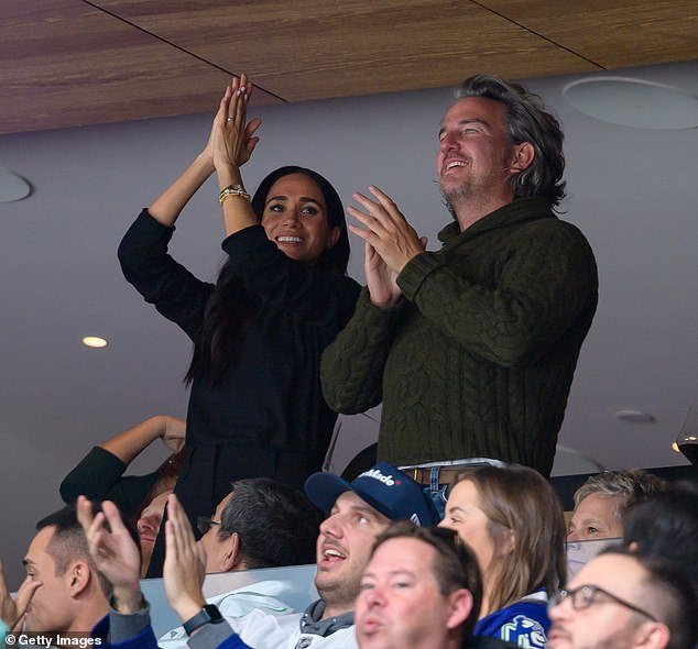 Meghan Markle celebrates during the NHL game in Canada - a country that is very important to her and Harry because it is the place where they started courting