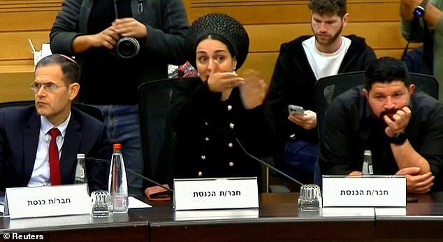 Israeli politicians (Anmog Cohen on the right in the photo) argue for or against the death penalty