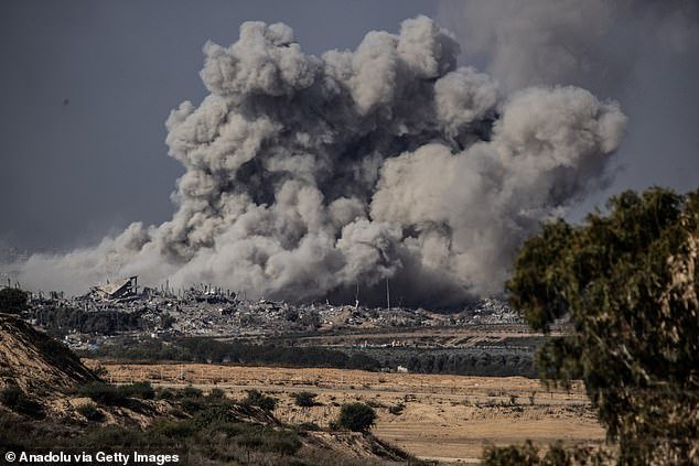 Smoke rises over Gaza during retaliatory airstrikes on the Gaza Strip, November 21