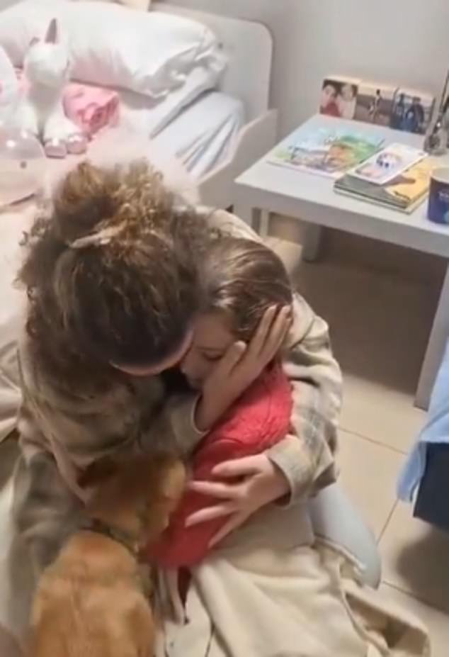Footage also shows the little girl being cuddled and comforted by her half-sister Natali as they are reunited