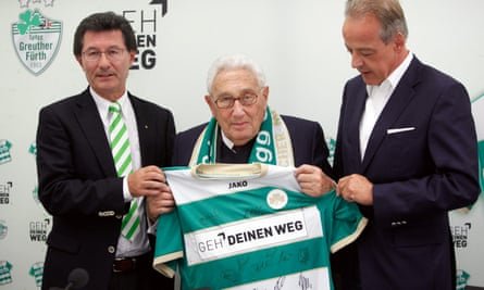 Henry Kissinger is presented with a shirt from the team he supported in 2012, Greuther Fürth.