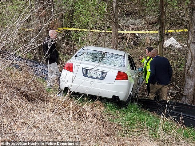 Lanway's white 2005 Acura sedan (pictured) had veered off a construction road, down an embankment and into a tree, and the occupants were both fatally shot multiple times