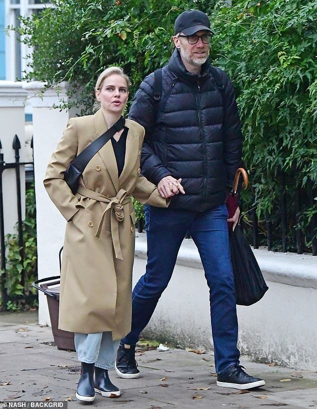Couple: 6ft tall Stephen Merchant, 48, held hands with his girlfriend Mircea Monroe, 41, as they stepped out hand in hand in Primrose Hill on Sunday