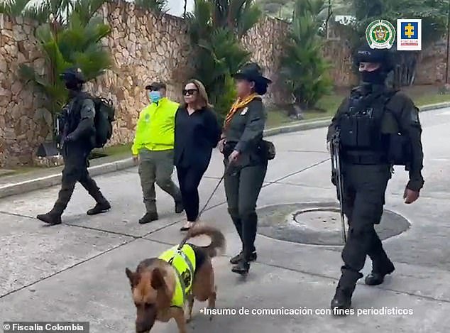 Nancy Gonzalez here in handcuffs in July 2022 after being arrested by authorities in Cali, Colombia for smuggling endangered crocodile and snakeskin bags into the US