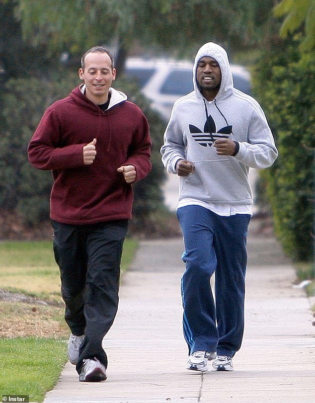 Claim;  Kanye West believes his ex-personal trainer Harley Pasternak is following him in Dubai - a year after the rapper leaked alleged text messages from his 'creepy' former employee threatening to have him 're-institutionalised' (pictured together 2016 )