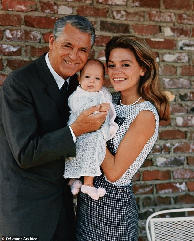 Three and a half month old Jennifer Grant flashes a big smile for the cameraman as she makes her debut with her famous parents Cary Grant and Dyan Cannon