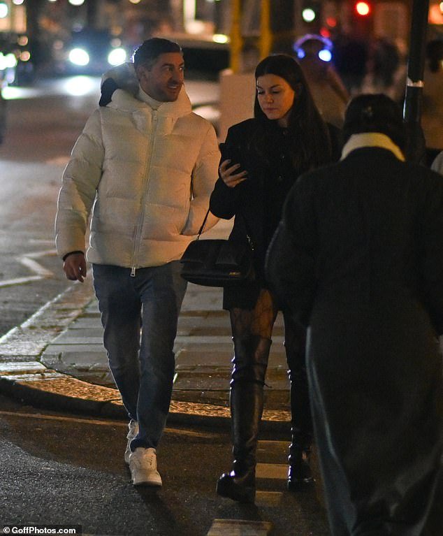 New guy?  Imogen Thomas, 40, put on a very cozy performance with a new mystery man as she left the Biltmore hotel in Mayfair on Saturday evening