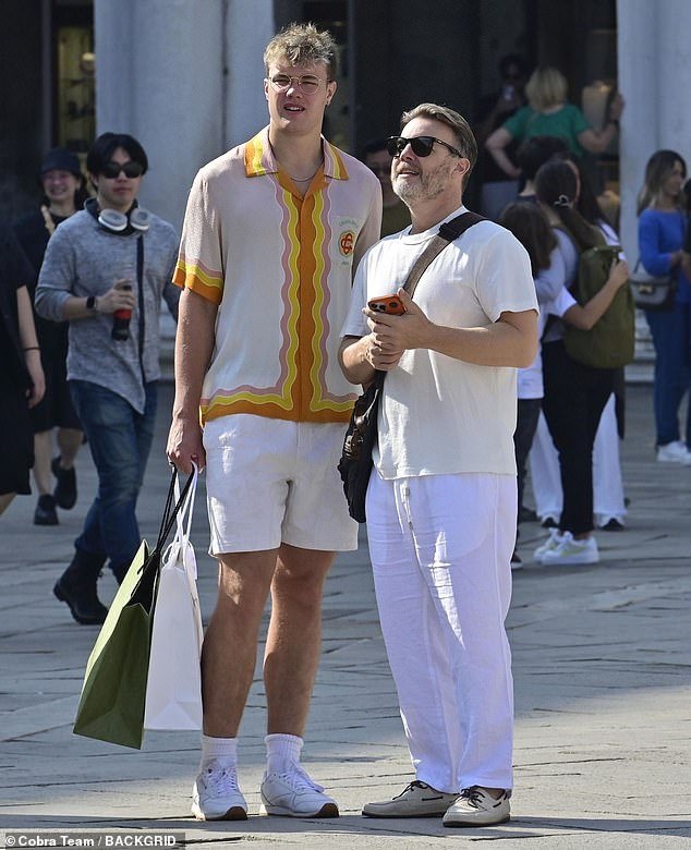 Wow: Gary Barlow, 52, was overshadowed by his son Daniel, 22, while on holiday with the family in Venice on Tuesday