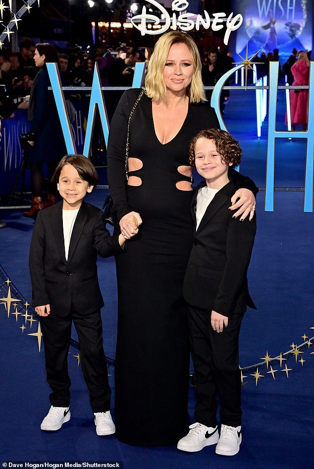 Stunning: Kimberley Walsh oozed chic as she attended the Wish premiere in London with her two sons Bobby and Cole - after Nicola Roberts dropped a hint about the future of Girls Aloud