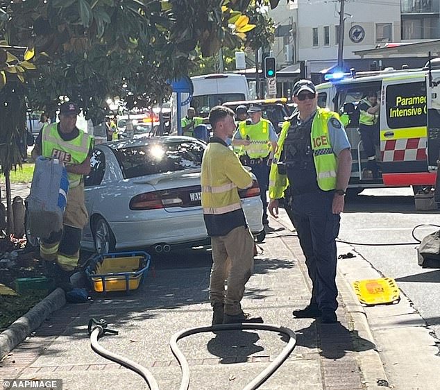 A 12-year-old boy was stuck between a tree and a car for 40 minutes after the 17-year-old driver climbed a curb in Kingsford (photo, emergency services on scene)