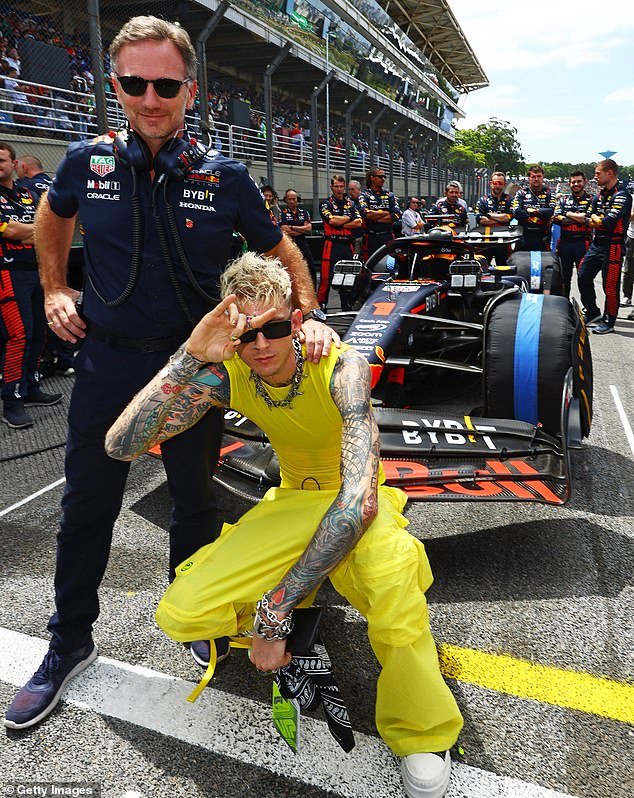 Support: Max Verstappen went on to win the race - Machine Gun Kelly is pictured with team boss Christian Horner