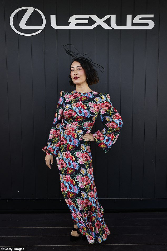 Melissa Leong (pictured) appeared to be in good spirits on Thursday as she made her striking entrance at Oaks Day in Melbourne