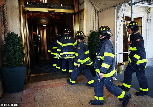 New York City's firefighter pension fund grew about 8.1 percent from fiscal year 2023. Pictured are FDNY officers entering a hotel residence in March