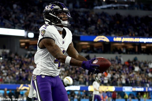 Ravens' Zay Flowers celebrates after scoring his second-ever career TD against the Chargers