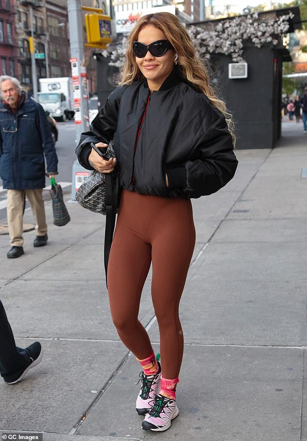 Busy: Rita Ora, 32, stunned in brown Lycra workout gear as she walked to a Pilates class in New York on Thursday