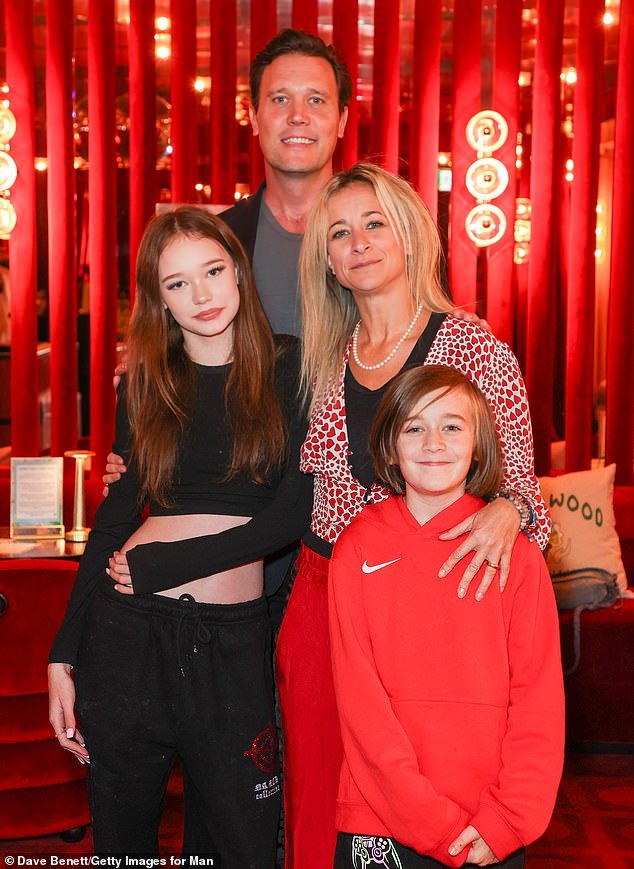 Future star: Ronnie Wood's granddaughter, 14-year-old Maggie MacDonald, is being hailed as the 'next Kate Moss'.  Maggie is pictured on the left in July with father Jack, mother Leah and brother Otis
