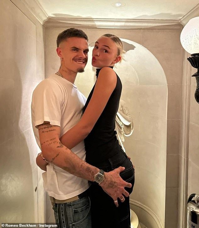 Cheeky: Romeo Beckham grabbed girlfriend Mia Regan's bum as they posed for Instagram photos ahead of celebrating her 21st birthday on Monday