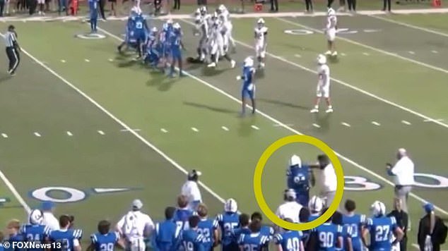 A high school football assistant coach in Florida was fired after he was seen on video punching a teenage player on his own team in the middle of last Friday night's game.