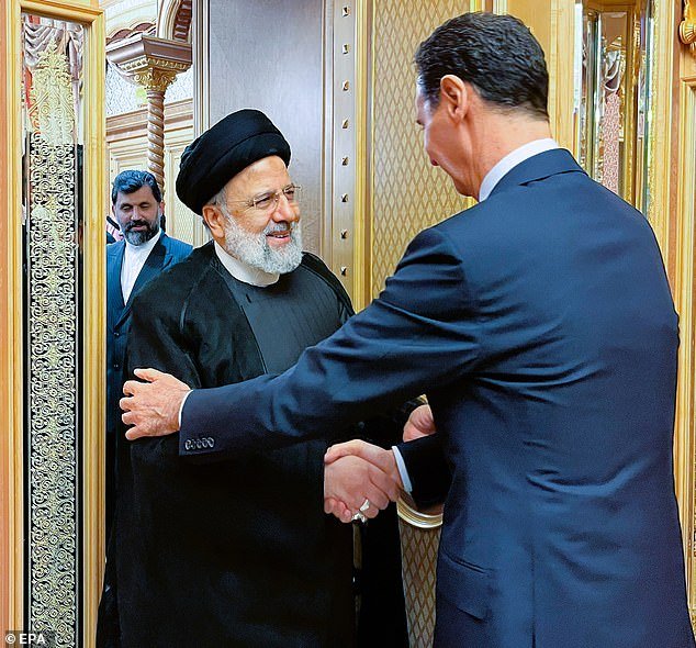 Iranian President Ebrahim Raisi (center) and Syrian President Bashar Al-Assad (right) are seen during a bilateral meeting in Riyadh, Saudi Arabia on Saturday.  Iranian-backed forces gained a foothold in Syria as they fought in support of Assad during the country's civil war