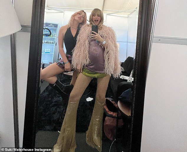 Baby bump: Suki Waterhouse, 31, happily showed off her growing baby bump in a glamorous selfie shared to Instagram on Monday - after confirming her pregnancy with boyfriend Robert Pattinson, 37