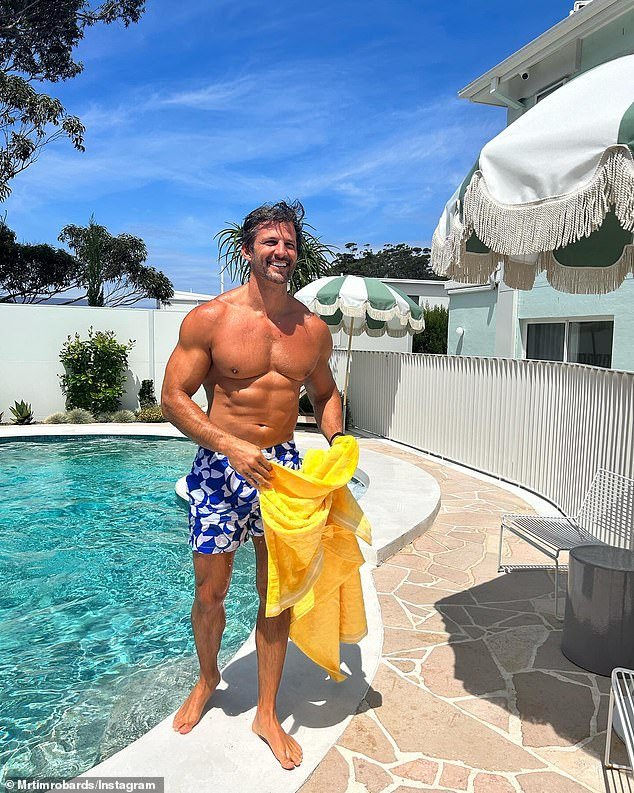 Ex-single Tim Robards, 41, showed off his ripped abs as he enjoyed a dip in a hotel pool in a series of photos he shared to Instagram on Wednesday