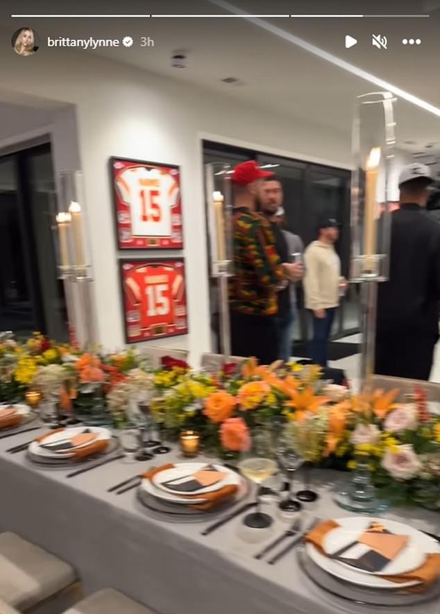 While Patrick's framed jerseys hang on the wall, you see a Kelce wearing a jersey drinking