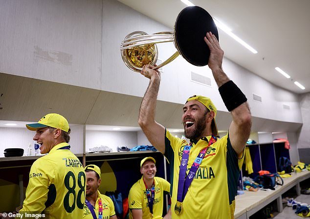 Glenn Maxwell holds up the World Cup trophy as the Aussies celebrated their underdog victory in Ahmedabad - but look closely at the photo and you'll see something is missing