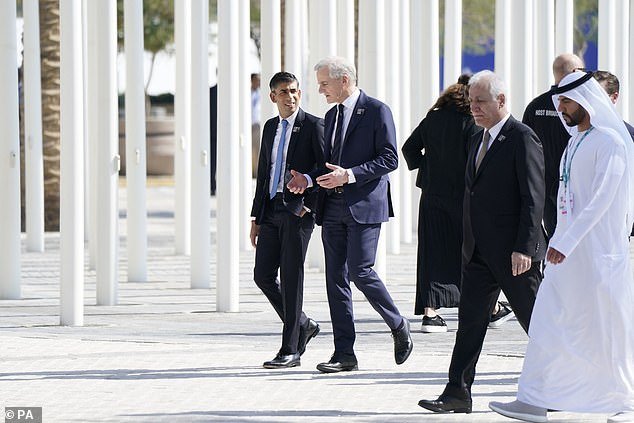 Prime Minister Rishi Sunak (left) walks with world leaders to the World Climate Action Summit in Dubai, during the Cop28 summit.  Photo date: Friday December 1, 2023