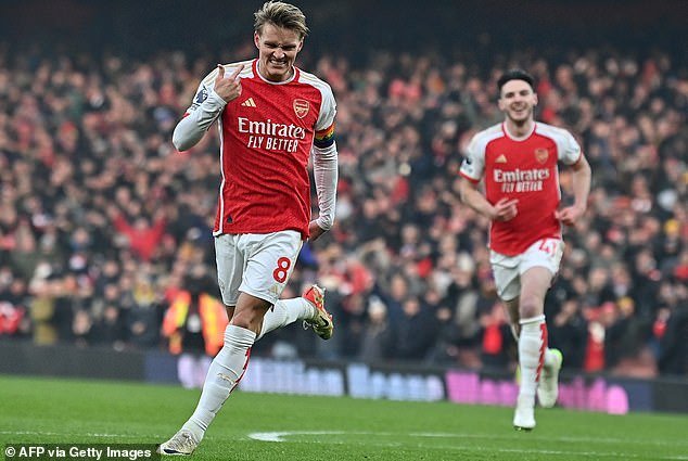 Gunners captain Martin Odegaard celebrates after doubling his lead in 13 minutes