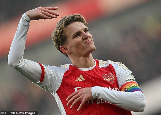 Odegaard celebrates in front of the home fans as Arsenal took control of the match