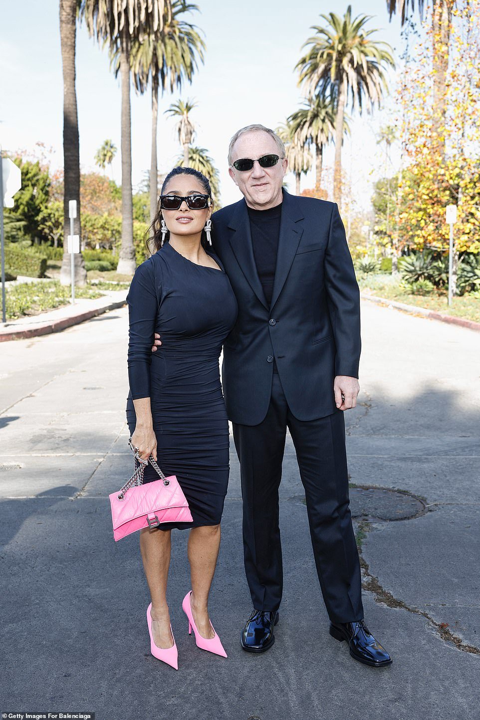 The Kering CEO looked dapper in a black suit, black shirt and sunglasses