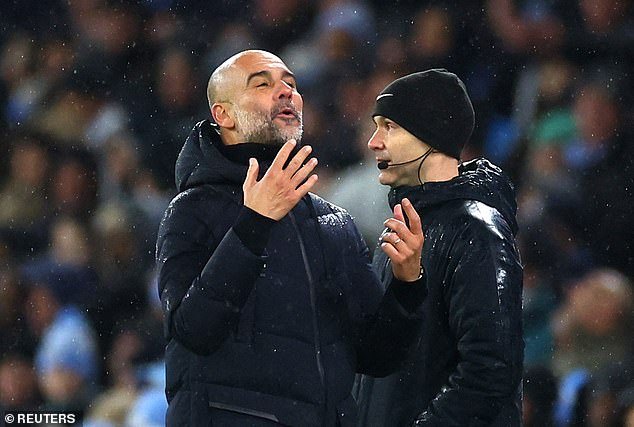 Pep Guardiola sarcastically hit fourth official Anthony Taylor (right) after the match.