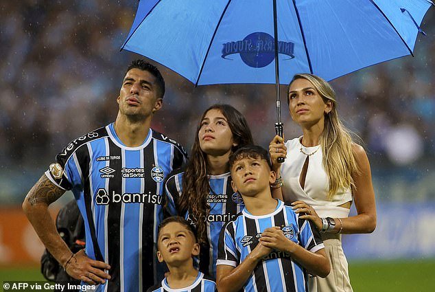 Suarez was accompanied at the farewell ceremony by his wife Sofia and their three children