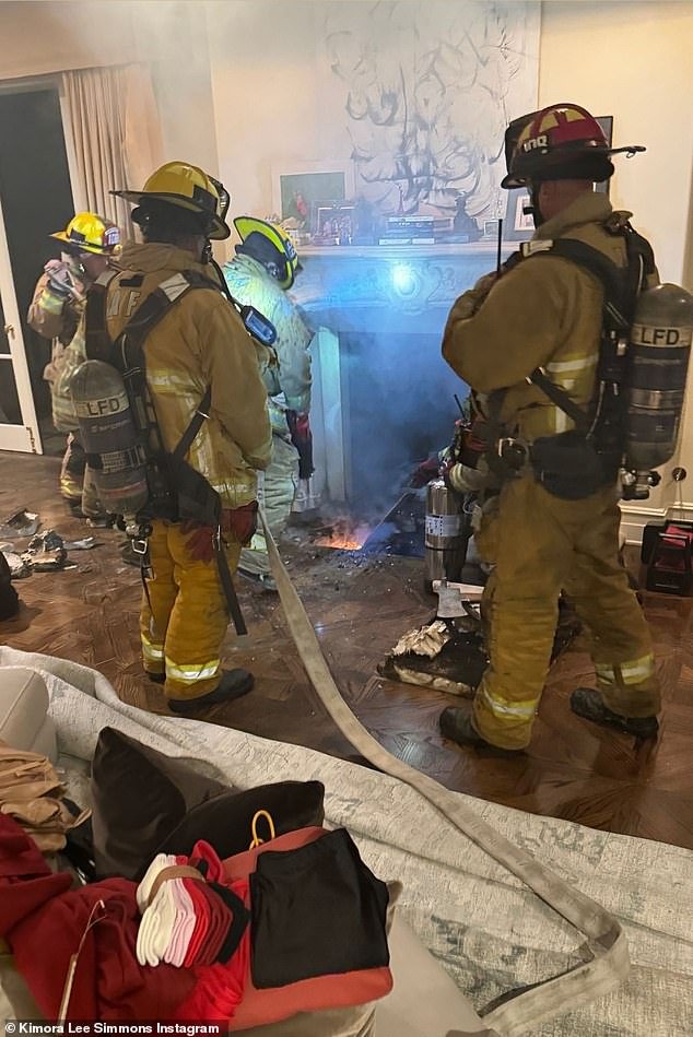 Four firefighters were working to extinguish the blaze, which had damaged the hardwood floor in the home