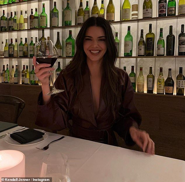 The model - who made Forbes' 30 Under 30 list - had a big smile on her face as she held up her glass of wine