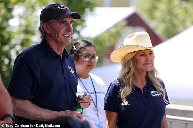 Burgum is seen here with wife Kathryn at the Iowa State Fair in August.  He slammed the RNC on Monday for its debate rules, which meant he was unlikely to qualify for the fourth showdown