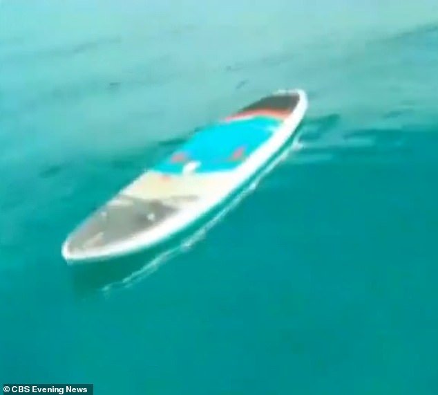A 44-year-old Boston newlywed's paddleboard is pictured floating in the Bahamas on Monday, shortly after she was fatally mauled by a shark the day after her wedding