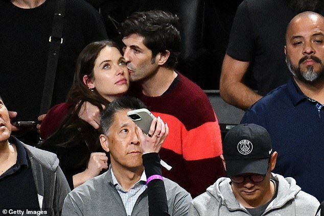 Ashley and Brandon share a PDA moment during an LA Lakers vs Orlando Magic game on October 30, 2023 in LA