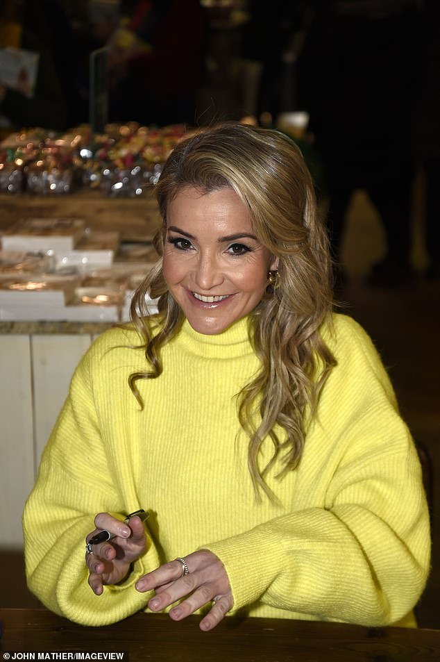 She wore a bright yellow high-neck jumper to reflect her sunny mood at the book signing at Cannon Hall Farm in Yorkshire