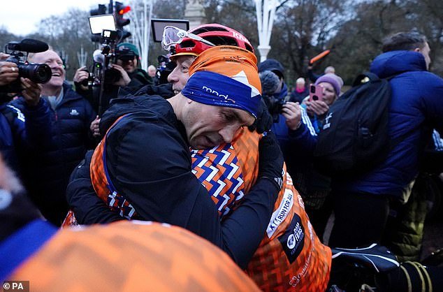 Sinfield fell into the arms of his team after completing the feat and running 186.4 miles