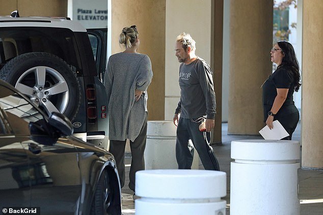 Sheppard wore a gray long-sleeved shirt and matching pants as he left the hospital six days after his heart attack