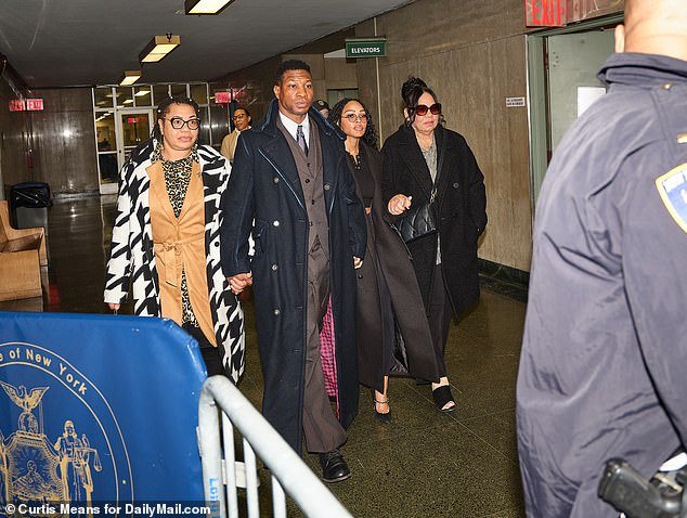 Majors (center) with his mother (left) and new girlfriend (right) on December 7.  Defense attorneys have called the case against Majors a 