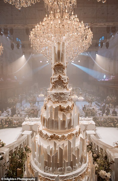 The 11-tier cake was 6 feet high and due to its height it was cut with an engraved sword.
