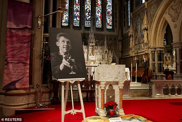 A photo of the late Irish singer Shane MacGowan is shown on the day of his funeral procession in Tipperary, Ireland