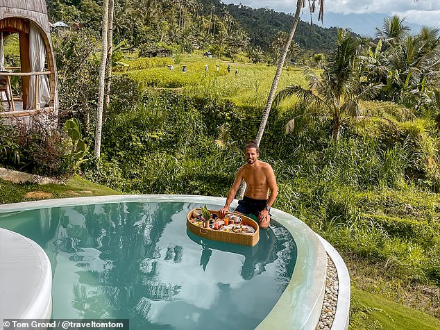 Tom said anyone can afford to enjoy South East Asia if they 'save some money' – claiming the region is 'so cheap'.  He is pictured here at the Oniria resort in Bali