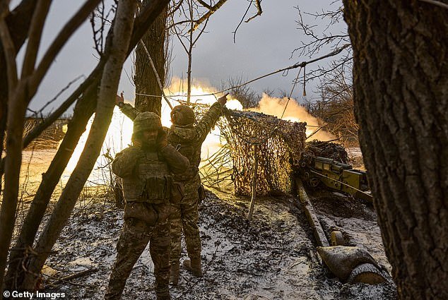 Ukrainian military soldiers fire the MT-12 or 2A29 cannon 'Rapira', a Soviet 100mm smoothbore anti-tank gun, in Avdiivka, Ukraine last week.  Both Ukraine and Russia have recently claimed gains in Avdiivka, where Russia continues a long-running campaign to capture the city, located in Ukraine's eastern Donetsk region.